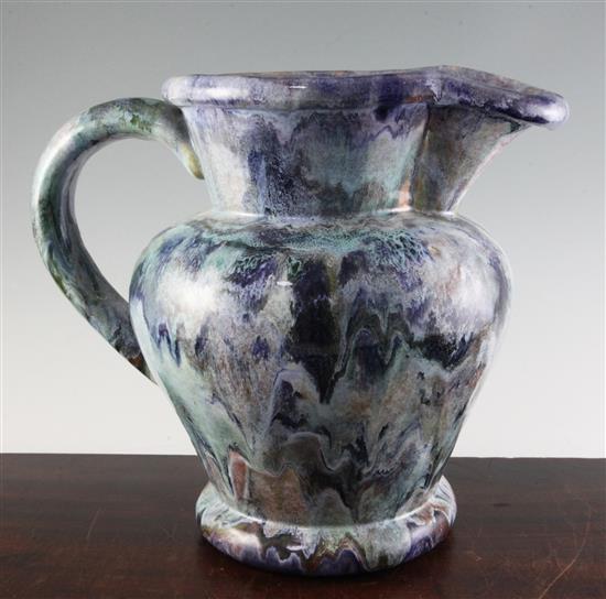 Kate Malone. A green, blue, white and ochre modelled stoneware ewer, 32cm